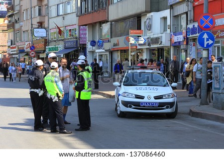 ISTANBUL - MAY 1: Many people can\'t take part in May Day march on May 1, 2013 in Istanbul. Police blocked all the ways to Taksim Square to prevent activists from joining their mates. May Day Streets
