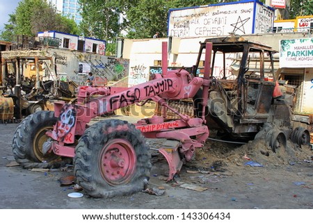 ISTANBUL - JUN 13: Protests turn to violent as police crack down on June 13, 2013 in Istanbul, Turkey. Construction machines had been parked on the part of Taksim Square being reconstructed.