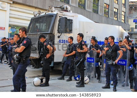 ISTANBUL - JUN 17: Five labor unions call 1-day nationwide strike over crackdown on June 17, 2013 in Istanbul, Turkey. Police lined up on Istiklal Street during the protest.