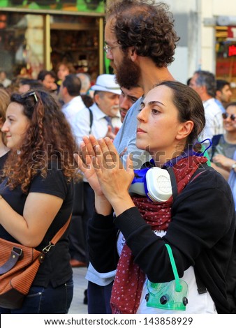 ISTANBUL - JUN 17: Five labor unions call 1-day nationwide strike over crackdown on June 17, 2013 in Istanbul, Turkey. Labor union members clap as they gather to protest against police brutality