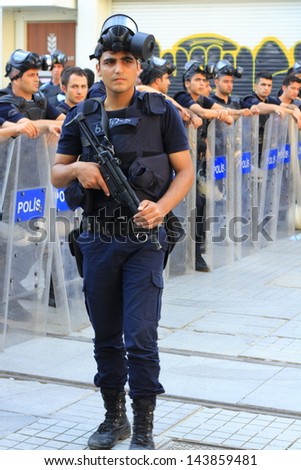 ISTANBUL - JUN 17: Labor unions call nationwide strike over crackdown on June 17, 2013 in Istanbul, Turkey. Police wait in full riot gear on Istiklal Street to prevent people march to Taksim Square.