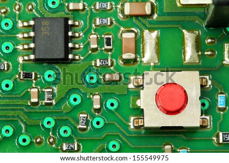 Circuit board. An operational amplifier and micro switch shown as soldered on the electronic card.