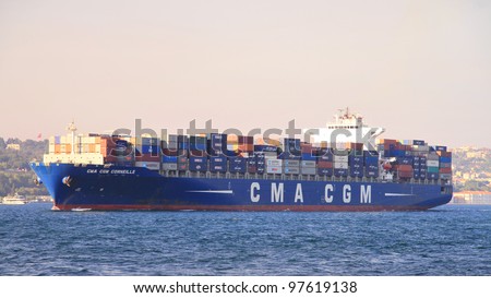 ISTANBUL - SEPTEMBER 24: Cargo Ship, Corneille (IMO: 9409170, Liberia) sails with full of containers in Bosporus on September 24, 2011 in Istanbul. 50,000 ships pass through the Straits every year