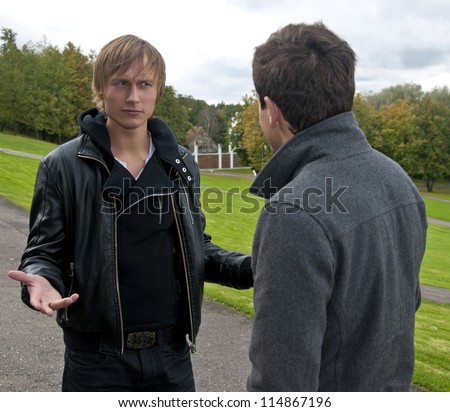 Two men talking in the park