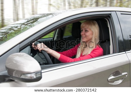 Girl in car, view front of door