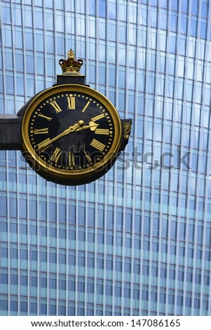 City of London. Clock of St Edmund, King and Martyr with 20 Fenchurch Street behind. 20 Fenchurch Street has been nicknamed the Walkie-Talkie and the Pint due to the distinctive shape of the building.