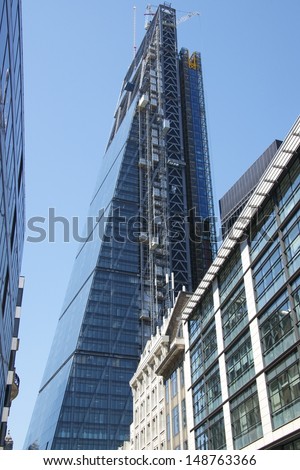 LONDON, UK - AUG 1: Leadenhall Building in construction on August 1, 2013, in London, UK. Roger Stirk Harbour + Partners (Richard Rogers) designed building (the Cheesegrater) completion due mid 2014.