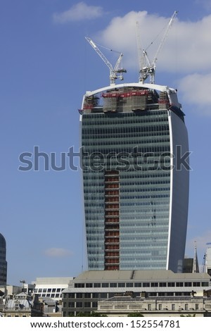 LONDON, UK - AUG 27: 20 Fenchurch Street in construction on August 27, 2013, in London, UK. The building hit the headlines for melting a car from reflected sunlight, City of London are investigating.