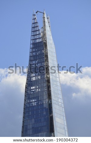 LONDON, UK - APRIL 14, 2014: Renzo Piano designed The Shard. Tallest building in the EU includes a hotel, three restaurants and with The View being a tourist attraction. Developer is Irvine Sellar.