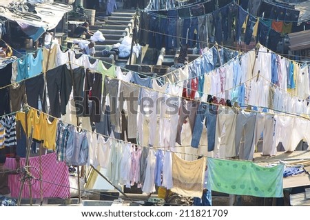 MUMBAI, INDIA - FEB 26, 2012. The Mahalaxmi Dhobi Ghat, Mumbai, said to be the world\'s largest outdoor laundry. 5,000 Dhobis live and work in the area. They wash clothes from hotels, hospitals & homes