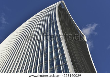 LONDON, UK - OCT 25: 20 Fenchurch Street in construction on October 25, 2014, in London, UK. Rafael Vinoly designed building (the Walkie-Talkie) with new window screens added, tenants Markel and Kiln.