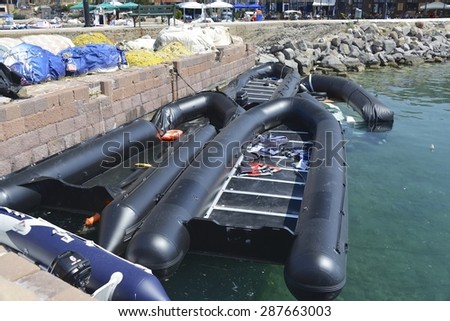 LESVOS, GREECE - JUNE 16, 2015 Inflatable boats used by immigrants to cross the sea from Turkey in Molyvos harbour, Lesvos Greece on June 16, 2015. Lesbos has become a hot spot for migrants to Europe.