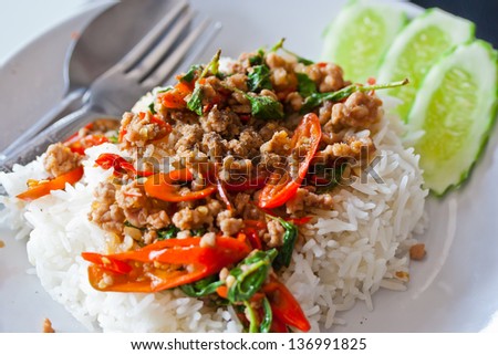 Basil Fried Rice with Pork./Basil fried rice with pork and white palette.