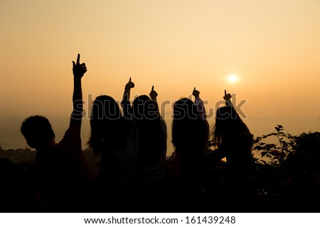 Sunrise with his arms outstretched