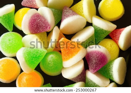 Background of colorful sprinkles, jelly for cake decoration or ice cream topping