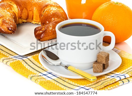 cup of coffee, fresh croissant and juice orange