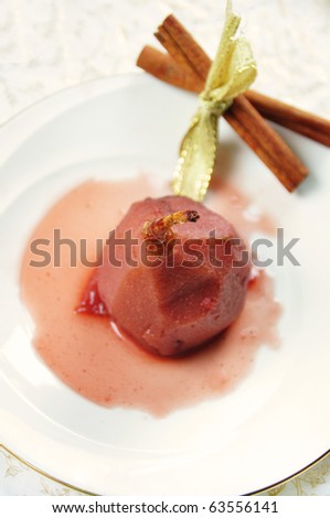 dessert of pears poached in a syrup  and red wine