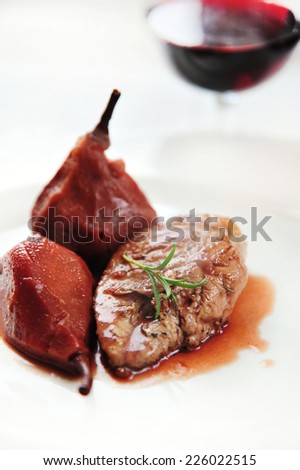 pheasant fillet with poached pear  in red wine sauce