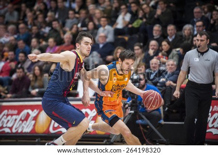 VALENCIA, SPAIN - MARCH 5: Sam Van Brossom  And Barcelona player during EURO CUP match between Valencia Basket Club and Bascelona F.C. Basket at Fonteta Stadium on March 22, 2015 in Valencia, Spain