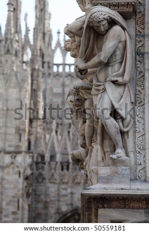 Statue on the Milan Cathedral. Gothic architecture