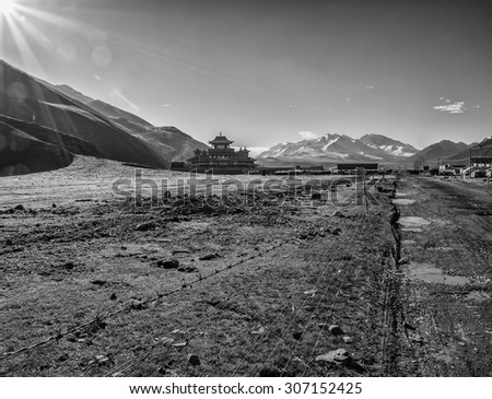 Black and White Travel Photo with Temple and Mountains