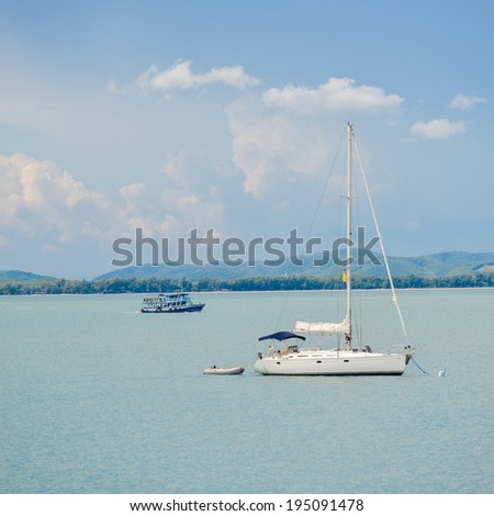 Sailing boat in open blue sea