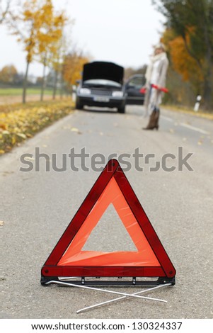 Warning triangle  placed in front of a car breakdown
