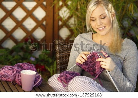 Woman Knitting On Terrace