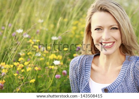 Happy woman in a flower field