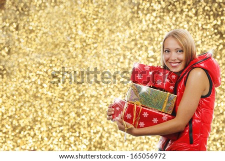 Happy girl with christmas parcels