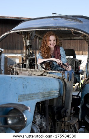 Young woman on a tractor