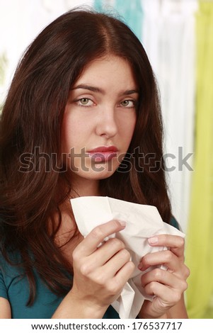 Woman with cold and handkerchief