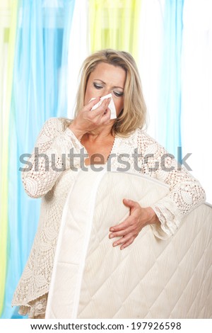 Woman with mattress and house dust mites