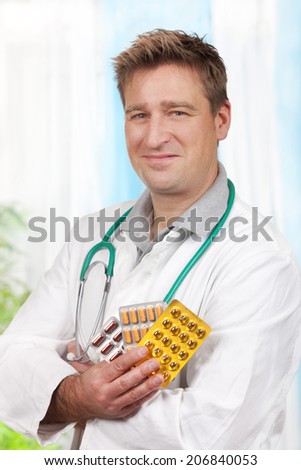 Male medical doctor with pills