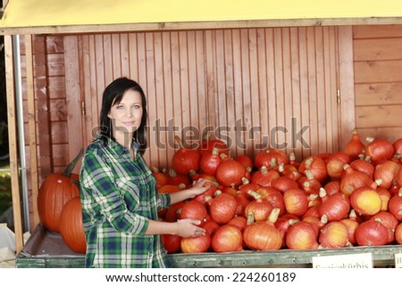Young woman with pumpkin