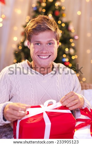 Happy single man with christmas gift