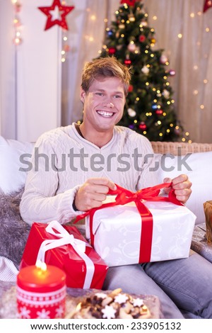 Happy single man with christmas gift