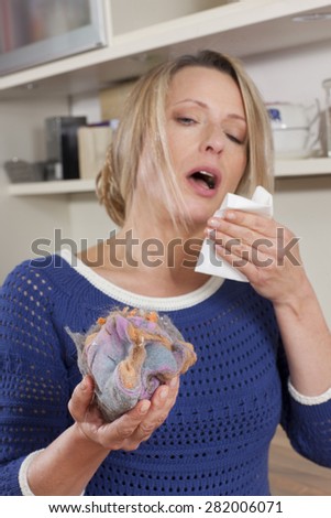 Woman with mite allergy and handkerchief