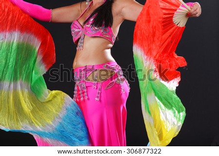 Woman with oriental costume doing belly dance