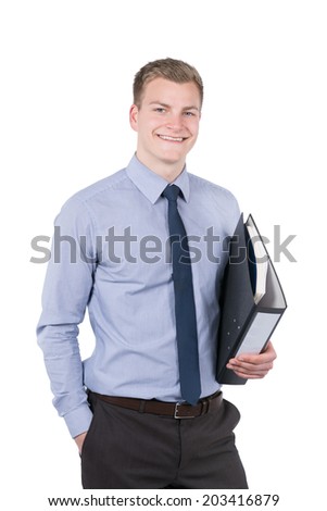 Cut out image of a young smiling businessman who is holding a file. He has one hand in his pocket. The man is looking to the camera.