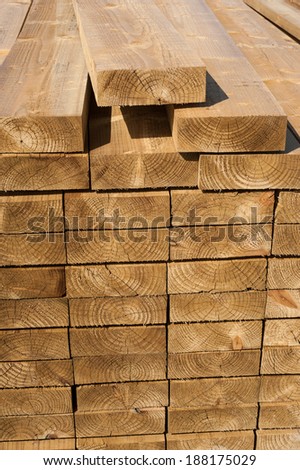 Stacks of wood planks in lumber yard