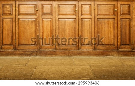 Old varnished wooden hinged cupboards with handles