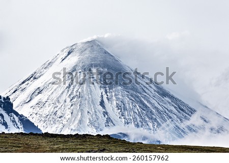 Beautiful nature of Kamchatka - mountain landscape: view on Kliuchevskoi Volcano (Klyuchevskaya Sopka) - highest mountain on Kamchatka, the highest active volcano of Eurasia.