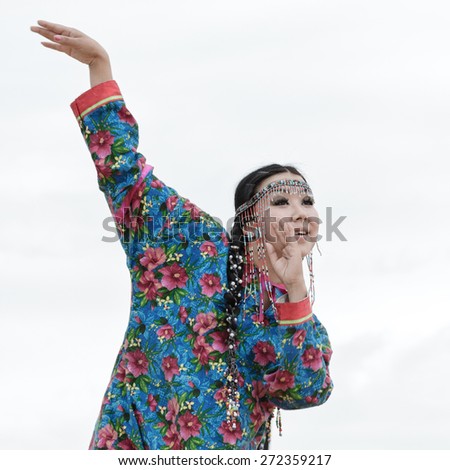 KAMCHATKA, RUSSIA - AUGUST 9, 2014: Expression woman dance. Public concert Koryak Folk Dance Ensemble Angt on the Khalaktyrsky Beach around Petropavlovsk-Kamchatsky City.