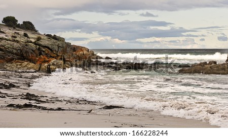 Beautiful nature coast with rocks and great waves in Tasmania, South Australia.