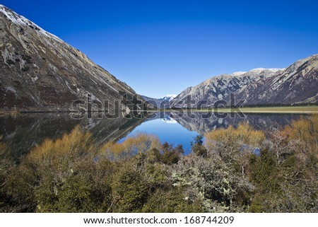 Amazing bright colors and nature features in New Zealand, just like this water reflection.