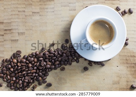 Coffee espresso white dish and many beans