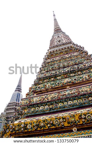 Thai Pagoda in Pyramid Shape with worm eye and white sky. Buddha temple in Thailand.
