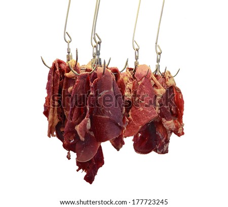 Piece of Beef hang with hook. fresh meat in market.on isolate white background.
