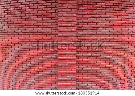 Brick paint with red color.Wall is vivid color and polished. Red wall in bow perspective.